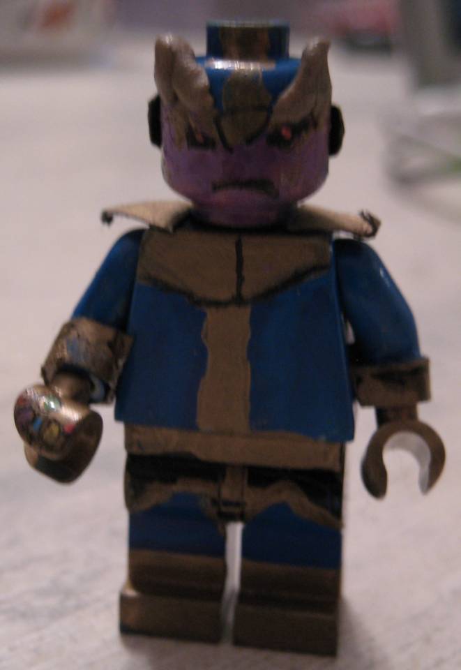 Thanos: Wonders what possessed him to pick up the Lego Infinity Gem. Now he is Lego, and so unable to move his arms to take it off his gauntlet.